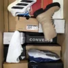 The photo shows a package with footwear in the category CS.