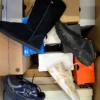 The photo shows a package with footwear in the category CS.