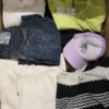 The photo shows a package with clothing in the category TSC.
