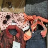 The photo shows a package with clothing in the category TSC.