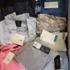 The photo shows a package with clothing in the category TSC.