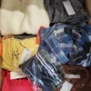 The photo shows a package with clothing in the category TSC.