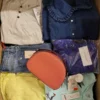 The photo shows a package with clothing in the category TSC.