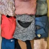 The photo shows a package with clothing in the category TSC.