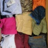 The photo shows a package with clothing in the category TSC.
