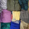 The photo shows a package with clothing in the category TSC.