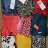 The photo shows a package with clothing in the category TSC.