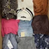 The photo shows a package with clothing in the category TSC.