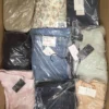 The photo shows a package with clothing in the category AP.