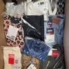 The photo shows a package with clothing in the category AP.