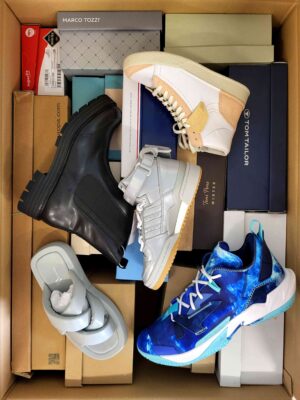 The photo shows a package with footwear in the category AS.