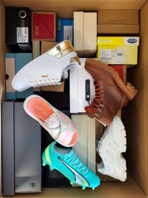 The photo shows a package with footwear in the category AS.