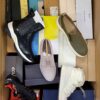 The photo shows a package with footwear in the category AS.