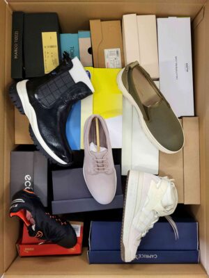 The photo shows a package with footwear in the category AS.