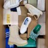 The photo shows a package with footwear in the category AS.