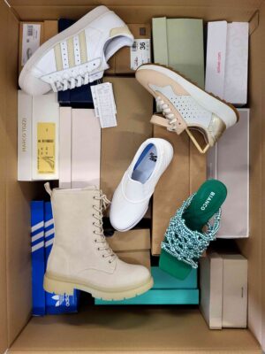 The photo shows a package with footwear in the category AS.