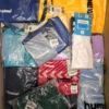 The photo shows a package with clothing in the category H.