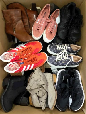 The photo shows a package with footwear in the category SH.