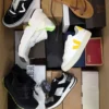 The photo shows a package with footwear in the category AS.