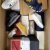 The photo shows a package with footwear in the category AS.