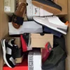 The photo shows a package with footwear in the category AS.