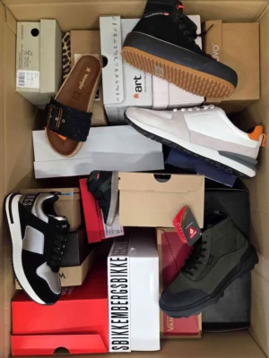 The photo shows a package with footwear in the category AS.