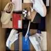 The photo shows a package with footwear in the category AS.