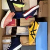 The photo shows a package with footwear in the category AS.