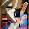 The photo shows a package with footwear in the category AS.