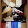 The photo shows a package with footwear in the category AS.