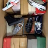 The photo shows a package with footwear in the category AS.