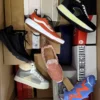 The photo shows a package with footwear in the category AS.