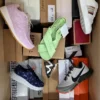 The photo shows a package with footwear in the category AS.
