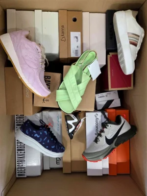 The photo shows a package with footwear in the category AS.