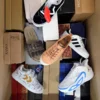 The photo shows a package with footwear in the category AS.