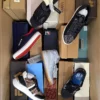 The photo shows a package with footwear in the category AS.