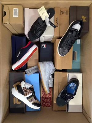 The photo shows a package with footwear in the category AS.