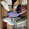 The photo shows a package with footwear in the category AS.
