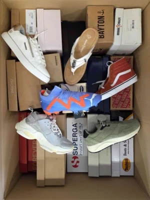 The photo shows a package with footwear in the category AS.