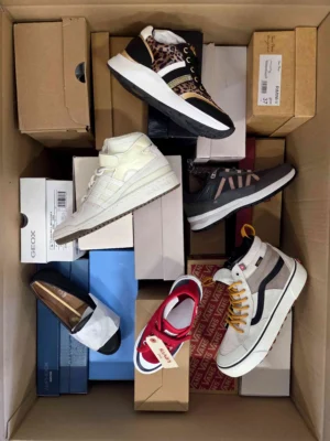 The photo shows a package with footwear in the category AS.