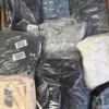 The photo shows a package with clothing in the category D.