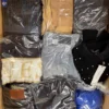 The photo shows a package with clothing in the category B.
