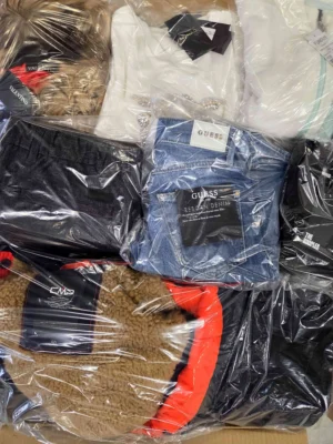 The photo shows a package with clothing in the category C.
