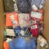 The photo shows a package with clothing in the category ABW.