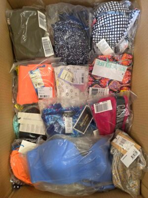 The photo shows a package with clothing in the category ABW.