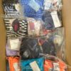 The photo shows a package with clothing in the category ABW.