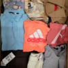 The photo shows a package with clothing in the category U.