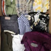The photo shows a package with clothing in the category U.
