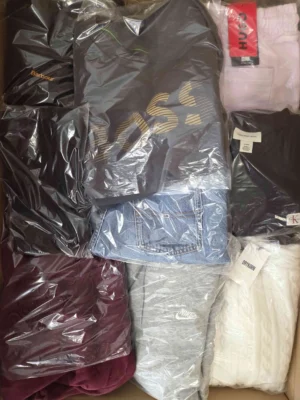 The photo shows a package with clothing in the category C.