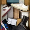 The photo shows a package with footwear in the category BS.